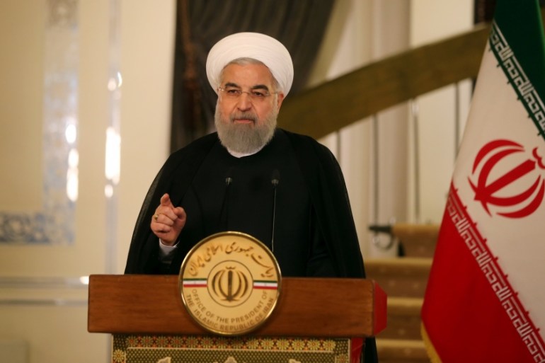 Iranian President Hassan Rouhani gestures during a television address in Tehran