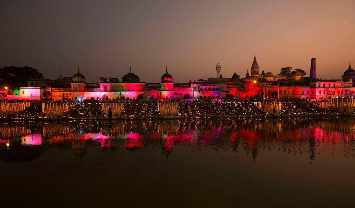 Devotees light earthen lamps on the banks of the River Sarayu as part of Diwali celebrations in Ayodhya, India, Wednesday, Oct. 18, 2017. Ayodhya is believed to be the birthplace of Hindu God Rama and