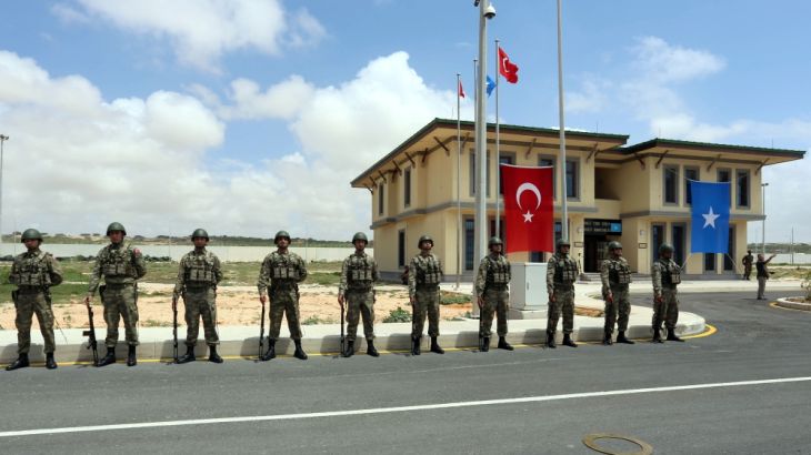 Turkish military officers parade during the opening ceremony of a Turkish military base in Mogadishu