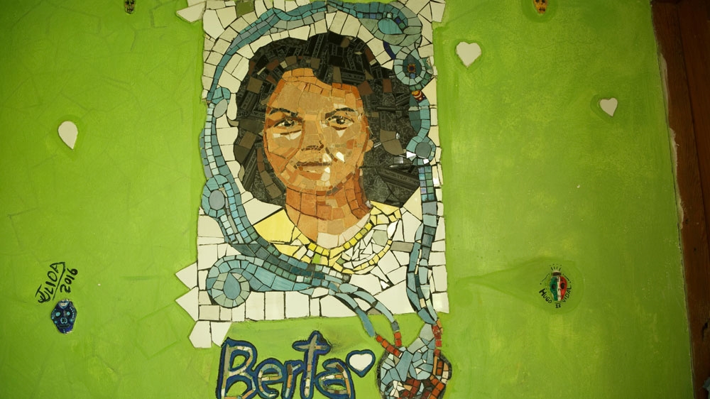 Fellow activists made and placed a mosaic in the halls of COPINH, the Civic Council of Popular and Indigenous Organizations of Honduras [Kavitha Chekuru/Al Jazeera] 