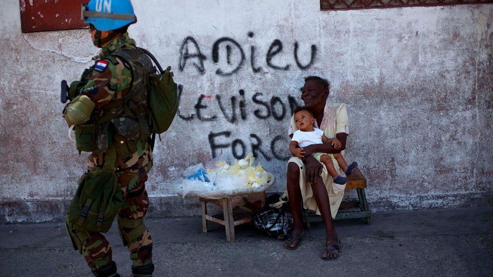 A UN peacekeeper from Paraguay patrols the streets of Port-au-Prince, 2011. [File: Ramon Espinosa/AP Photo] 