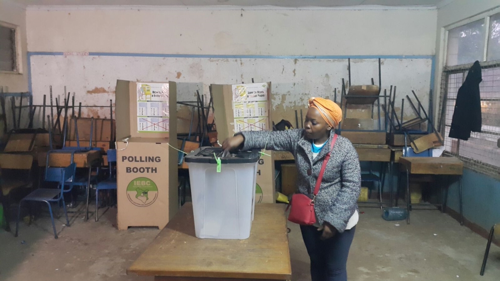 A voter who rose early makes her choice at a polling station in Nairobi, the capital [Hamza Mohamed/Al Jazeera]