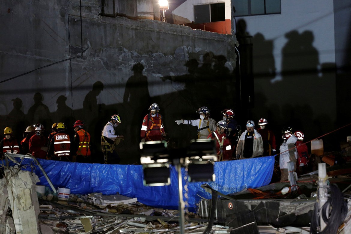 Members of a rescue team continue to work in the rubble of a collapsed building in Mexico City while searching for the last bodies of the Sept. 19 earthquake. REUTERS/Daniel Becerrill