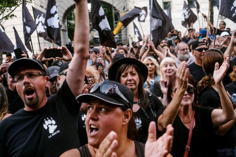 Supporters of Quebec group La Meute march during a protest to demand stronger border controls in Quebec City