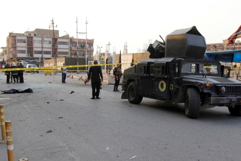 A military vehicle of Iraqi security forces is seen at the site of a suicide bomb attack in Kirkuk