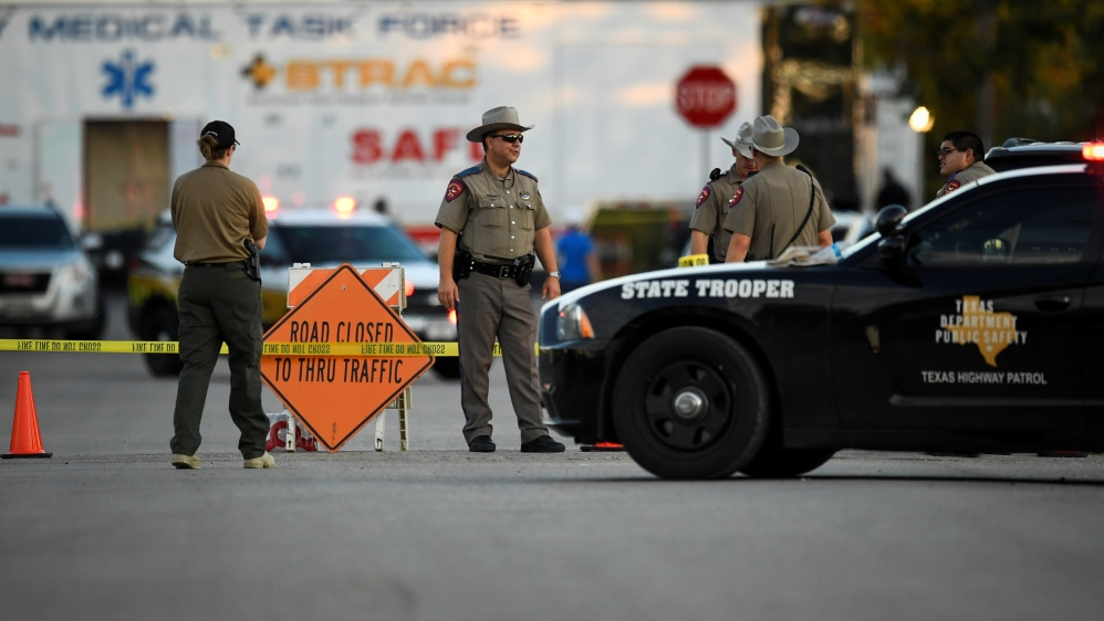 Law enforcement officials set up along a street near the First Baptist Church after the mass shooting in Sutherland Springs [Mohammad Khursheed/Reuters]
