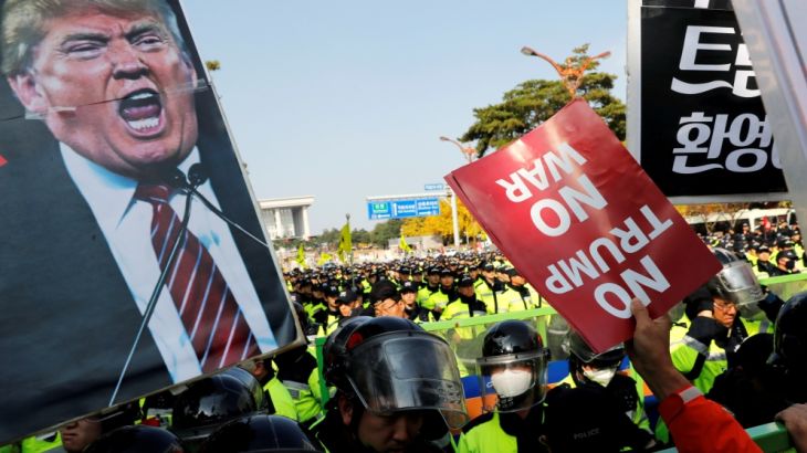 Protesters take part in an anti-Trump rally nearby the presidential Blue House in central Seoul
