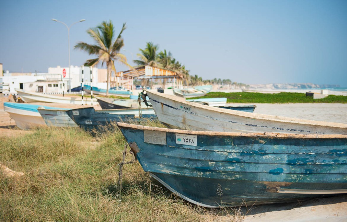 Fishing boats rest along the seascape in the town of Taqah. [Wojtek Arciszewski/Al Jazeera]