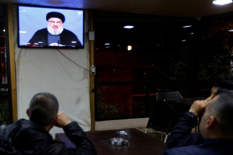 People watch Lebanon''s Hezbollah leader Sayyed Hassan Nasrallah as he speaks on television in Beirut