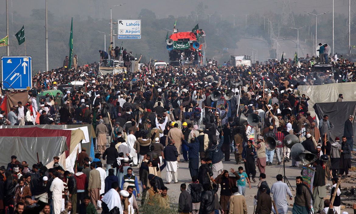 Protesters express their supports to their leadership after clash with police, in Islamabad, Pakistan, Saturday, Nov. 25, 2017. Pakistani police have launched an operation to clear an intersection lin