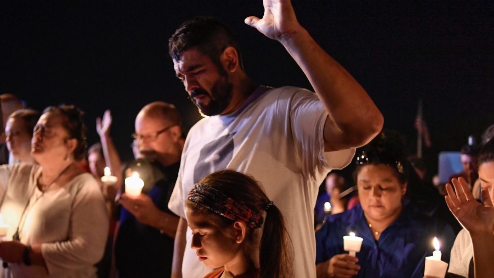 Local residents hold a candlelight vigil for victims of the shooting in Sutherland Springs, Texas. [Mohammad Khursheed/Reuters]