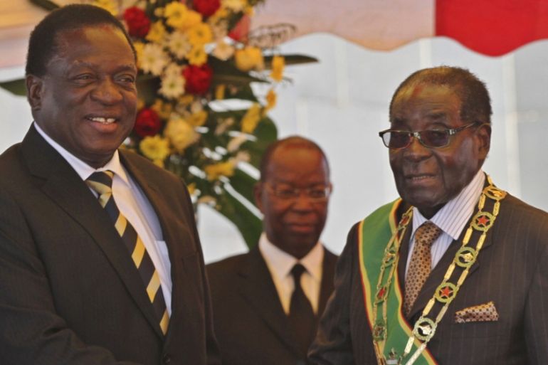 President Mugabe greets Vice President Mnangagwa as he arrives for Zimbabwe''s Heroes Day commemorations in Harare
