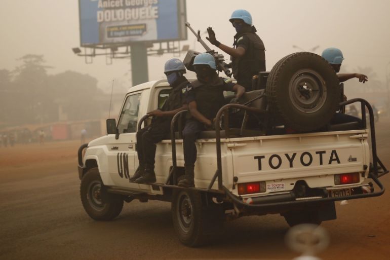 FILE- In this Feb. 12 2016 file photo, UN forces from Rwanda patrol the streets of Bangui, Central African Republic. The United Nations peacekeeping mission in the Central African Republic is requesti
