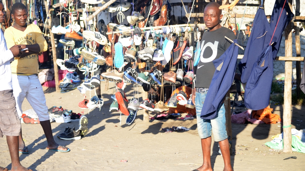 Vendors sell a range of items to fishermen in Beira [Andrew Mambondiyani/Al Jazeera]