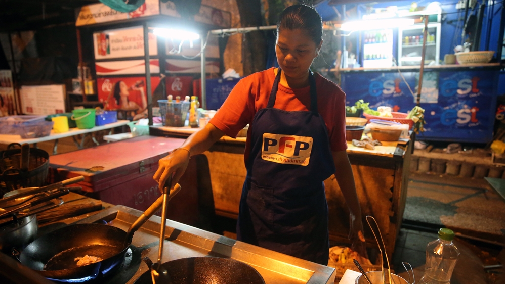 A street vendor cooks Pad Thai in Bangkok, Thailand [Godong/UIG via Getty Images]