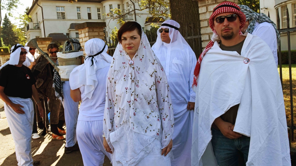 
The anti-Islamic group known as Block Against Islam gather at the Saudi Embassy in Prague to mock the Hajj pilgrimage in September 2016 [Philip Heijmans/Al Jazeera]
