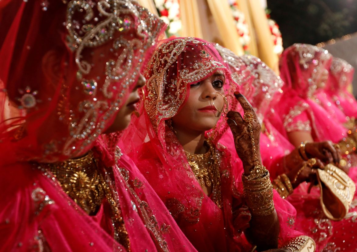 Indian brides wait for the start of a mass marriage ceremony in Mumbai, India, November 20, 2017. REUTERS/Danish Siddiqui
