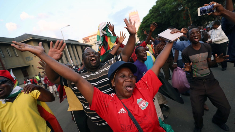 Harare residents celebrate Mugabe's resignation [Mike Hutchings/Reuters]