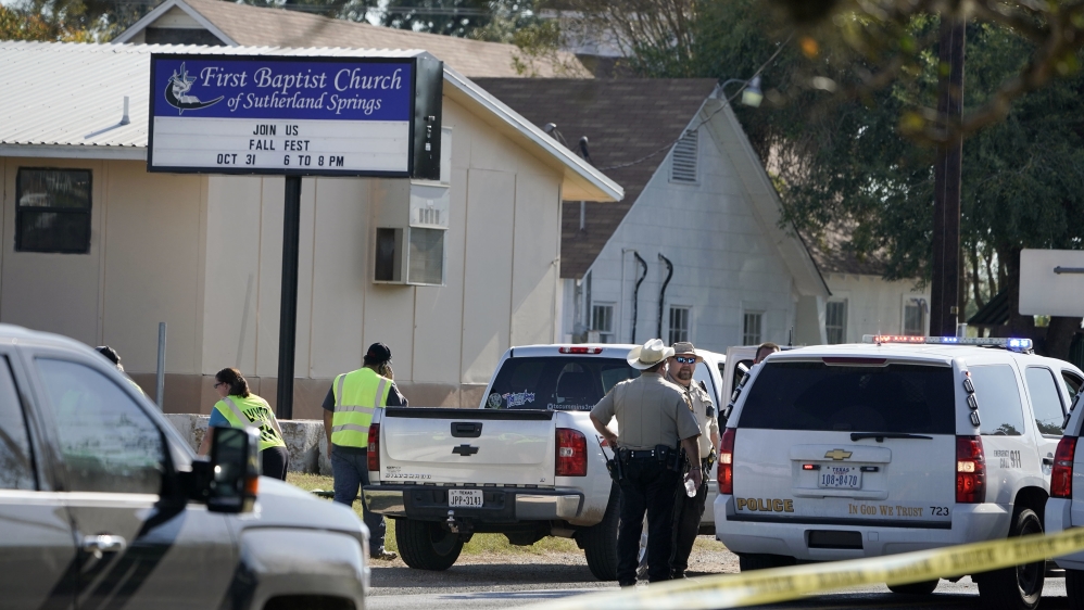 Law enforcement officers gather in front of the First Baptist Church of Sutherland Springs after a fatal shooting [Darren Abate/AP Photo]