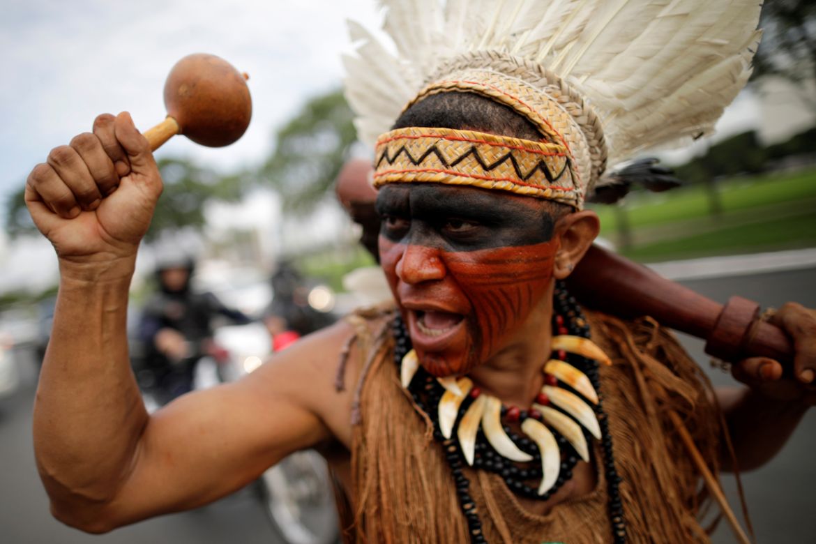 An indigenous man from the Pataxo tribe takes part in a protest against an opinion of the General Advocacy of the Union about the demarcation of indigenous lands, at the Esplanade of Ministries in Bra