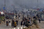 Police fire tear gas shells to disperse protesters during clashes in Islamabad, Pakistan on November 25 [AP/Anjum Naveed]
