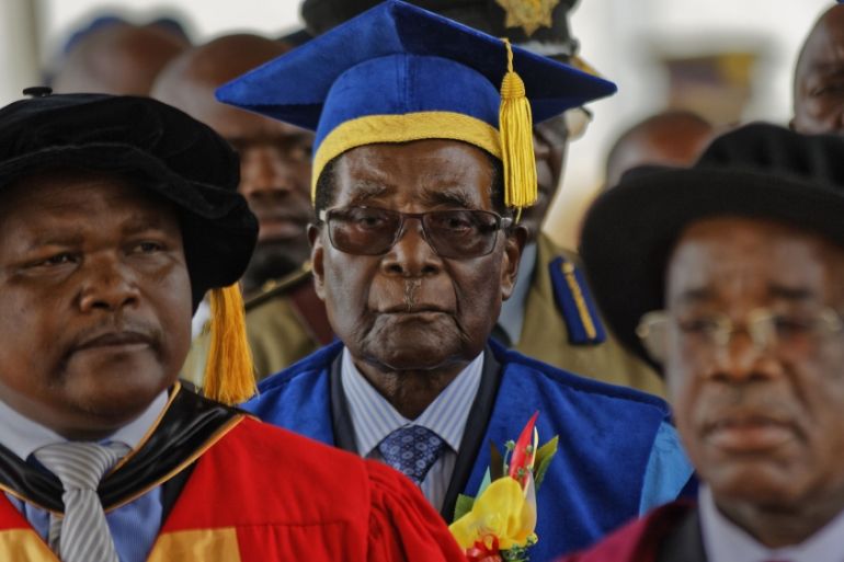 Zimbabwe''s President Robert Mugabe, center, arrives to preside over a student graduation ceremony at Zimbabwe Open University on the outskirts of Harare, Zimbabwe Friday, Nov. 17, 2017. Mugabe is mak