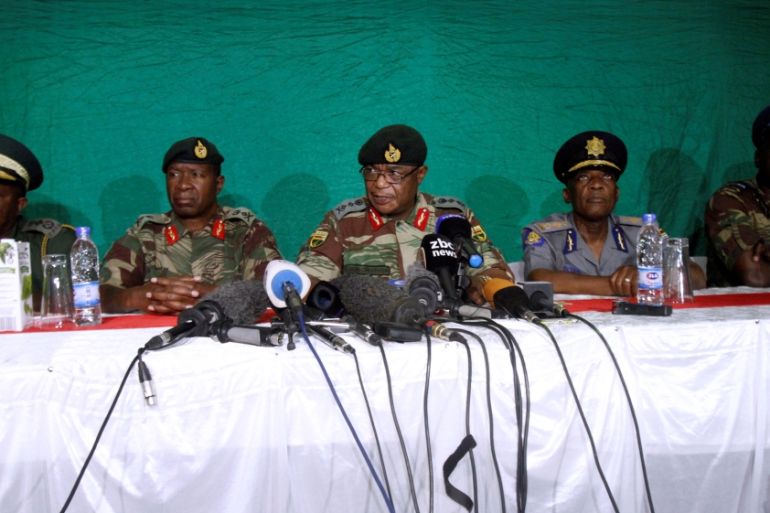 Commander of Zimbabwe Defence Forces General Chiwenga (C) addresses the media with other security chiefs in Harare