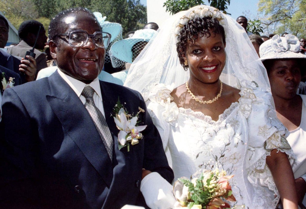 President Robert Mugabe and new wife Grace leave the Kutama Catholic Church August 17, 1996 after exchaning their wedding vows. The couple were traditionally married shortly after the death of Mugabe''
