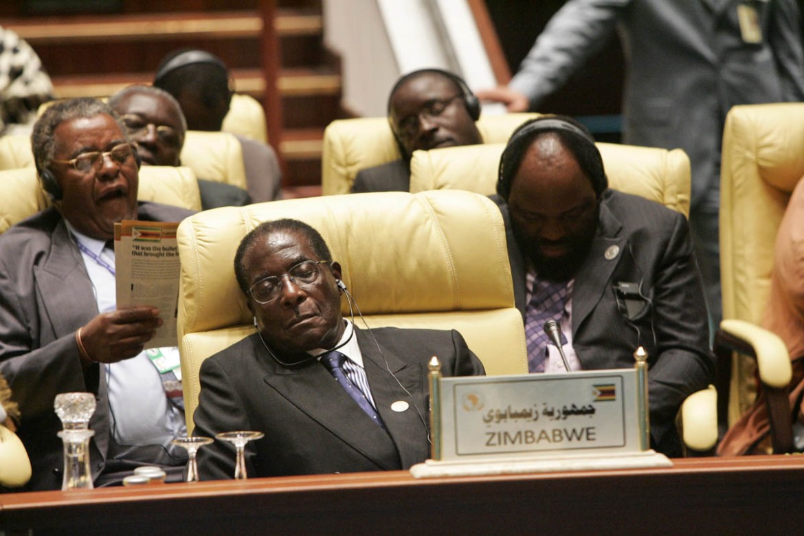 President Robert Mugabe of Zimbabwe takes a break during the 5th summit of the African Union. (Photo by Patrick ROBERT/Corbis via Getty Images)