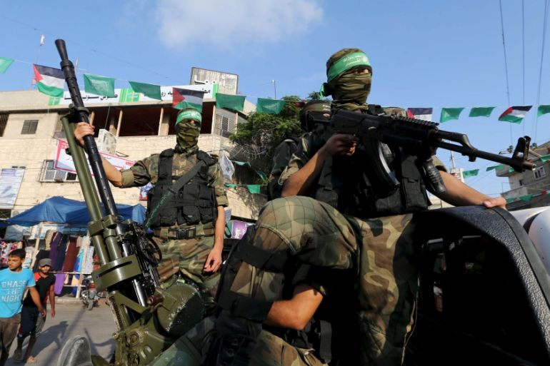 Palestinian members of the al-Qassam Brigades, the armed wing of the Hamas movement, take part in an anti-Israel parade in Rafah, southern Gaza Strip