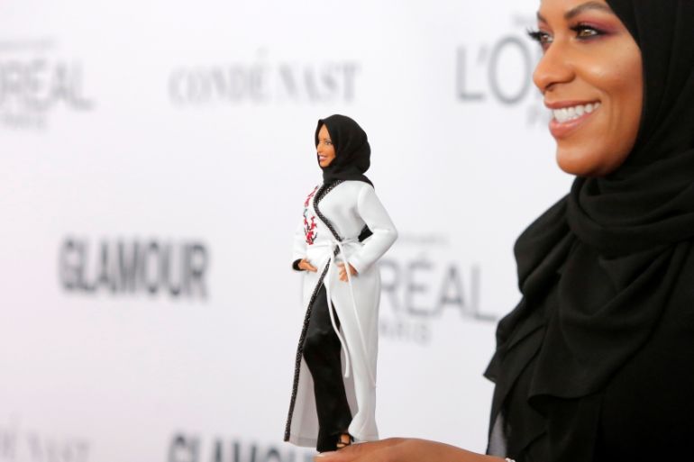 Olympic fencer Ibtihaj Muhammad holds a Barbie doll made in her likeness as she attends the 2017 Glamour Women of the Year Awards at the Kings Theater in Brooklyn, New York.