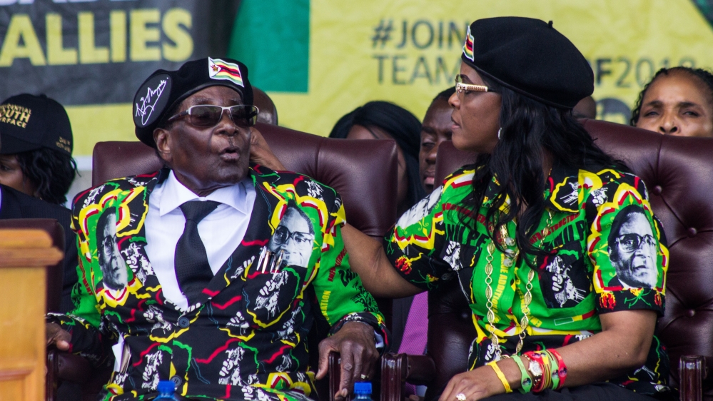President Robert Mugabe sits with his wife, Grace, at a youth interface rally in the second city of Bulawayo on November 4 [Tendai Marima/Al Jazeera]