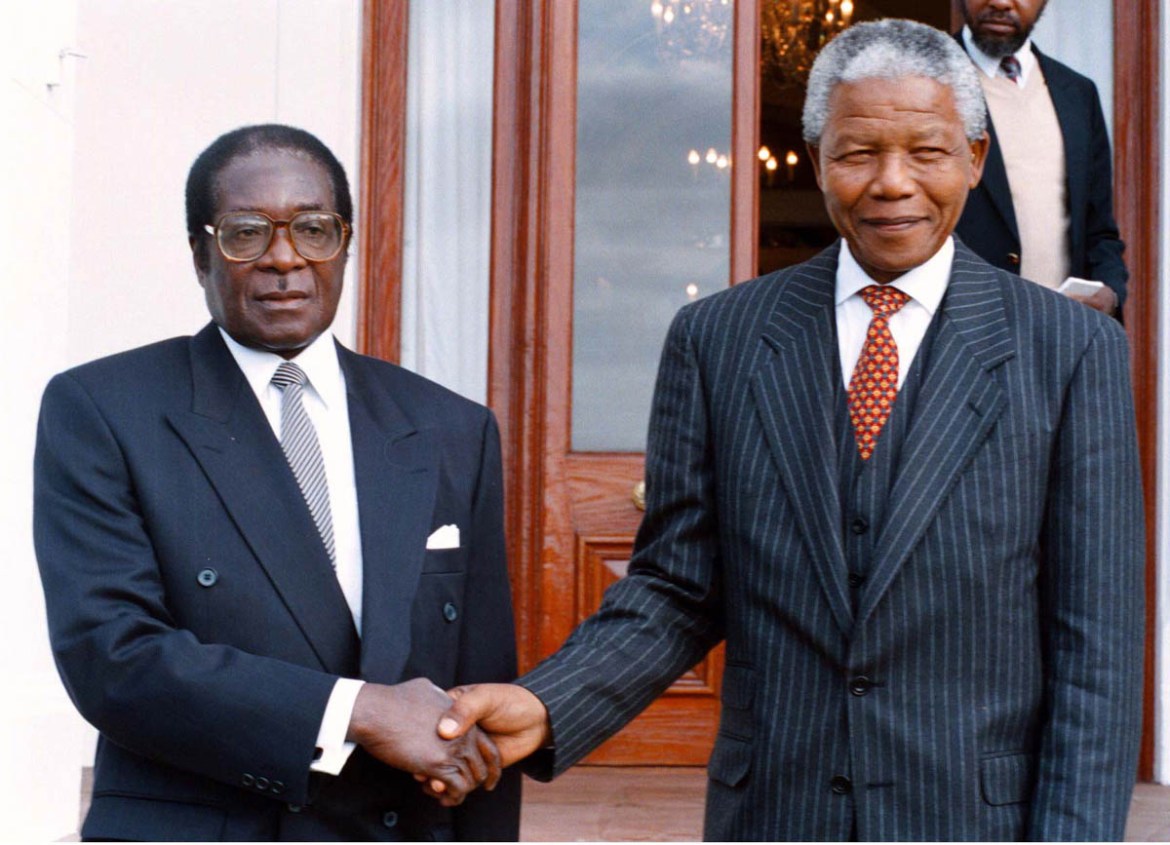 SOUTH AFRICA - JANUARY 01: South Africa. Nelson Mandela as President, pictured with Zimbabwean president, Robert Mugabe during a state visit.. (Photo by Media24/Gallo Images/Getty Images)