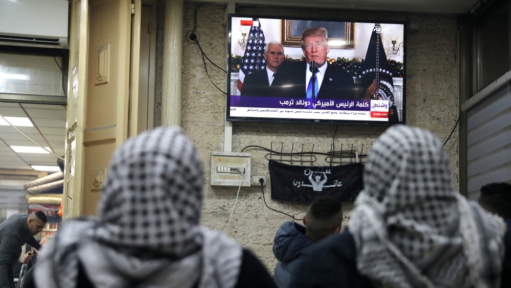 Palestinians in Jerusalem's Old City watch Trump televised speech [Ammar Awad/Reuters]