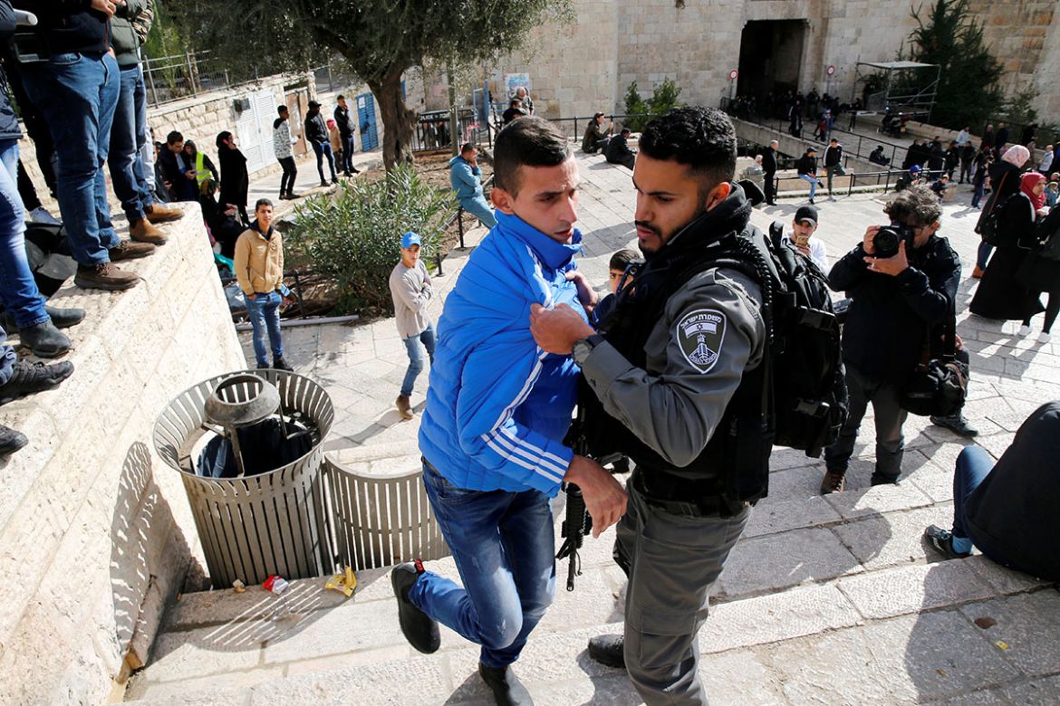 An Israeli border policeman scuffles with a Palestinian man during a protest following U.S. President Donald Trump''s announcement that he has recognized Jerusalem as Israel''s capital, near Damascus Ga