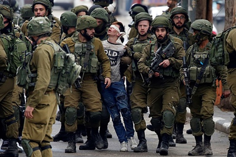Beaten' Palestinian boy in viral photo charged | Conflict News | Al Jazeera