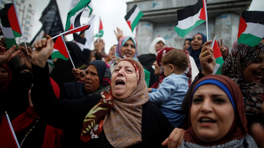 Palestinian women in Gaza shouted slogans during a protest against the US intention to move its embassy to Jerusalem and to recognise Jerusalem as the capital of Israel [Mohammed Salem/Reuters]