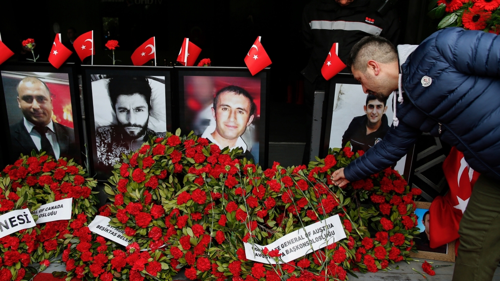 A man leaves a carnation outside the Reina nightclub in Istanbul. [Emrah Gurel/The Associated Press]
