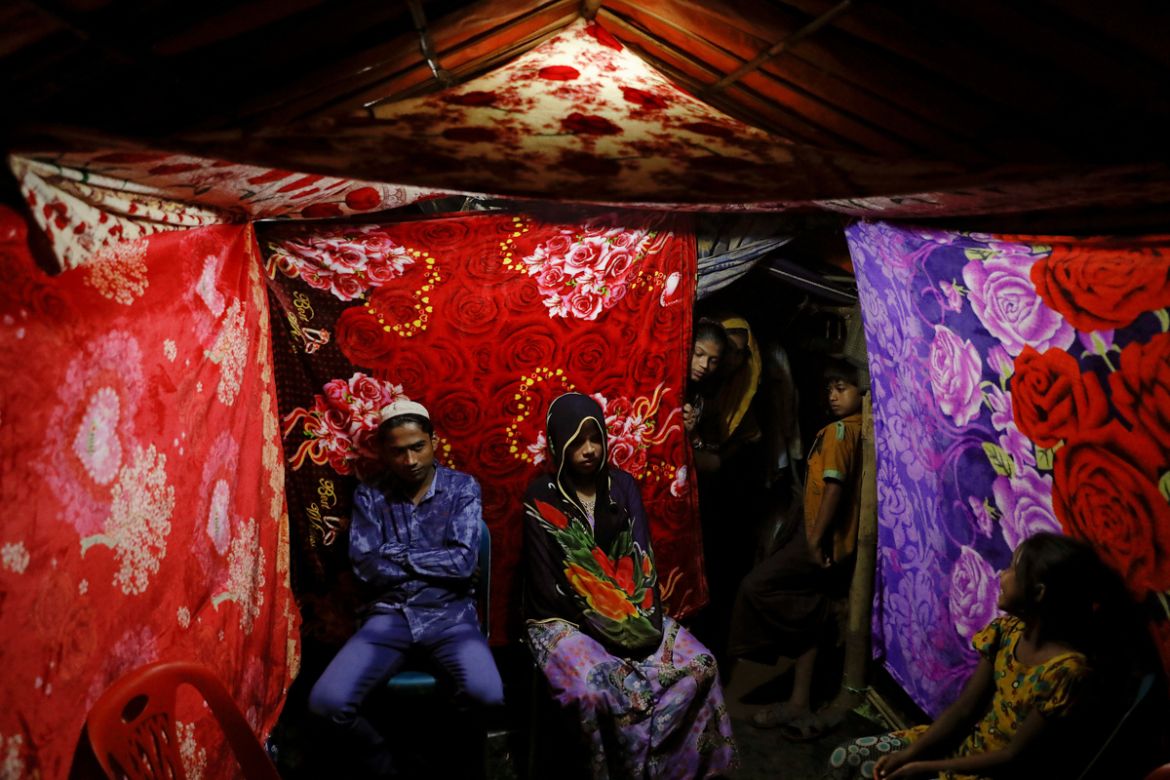 Rohingya refugees Saddam Hussein, 23, and Shofika Begum, 18, pose for a picture in a tent decorated with blankets just after getting married at the Kutupalong refugee camp near Cox''s Bazar, Bangladesh