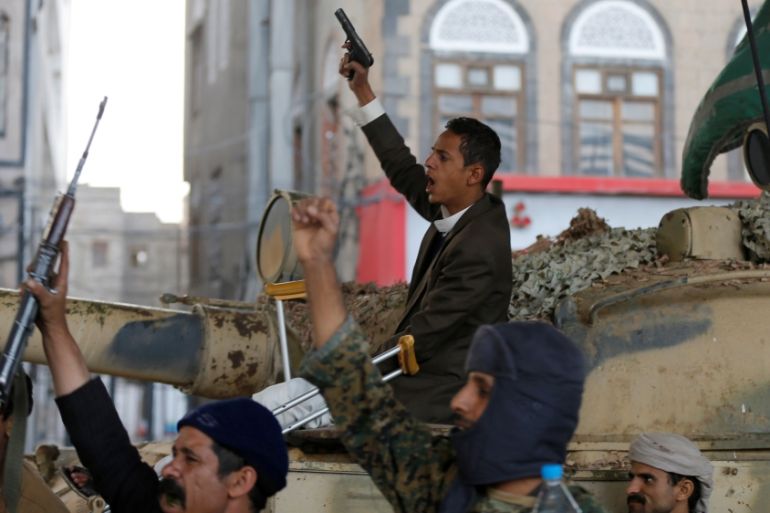 Houthi militants react as they gather next to a tank after the death of Yemen''s former president Ali Abdullah Saleh, in Sanaa