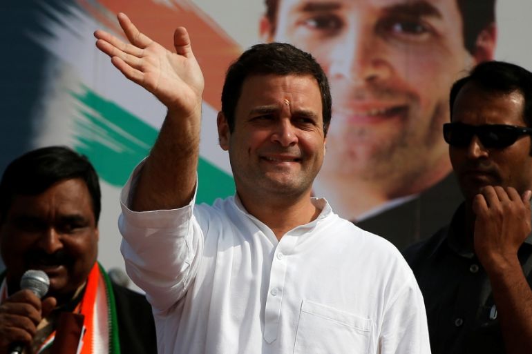 Rahul Gandhi, Vice-President of India''s main opposition Congress Party, waves to his supporters during a rally ahead of Gujarat state assembly elections, at a village on the outskirts of Ahmedabad