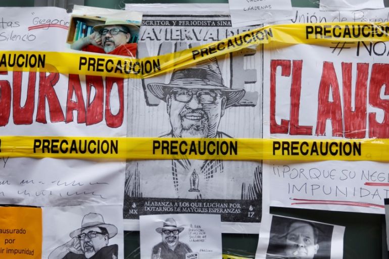 Pictures of journalists who have been killed in Mexico are pictured during a demonstration against the murder of journalists in Mexico, outside the building of Attention to Crimes against Freedom of E