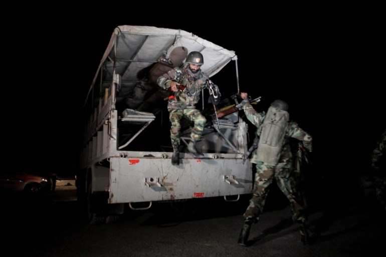 Pakistani troops deploy outside the Police Training Center after an attack on the center in Quetta