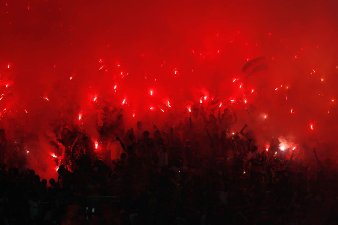 Fans of Brazil''s Flamengo soccer team light flares in the stands during a Copa Sudamericana final championship soccer match against Argentina''s Independiente at Maracana stadium in Rio de Janeiro, Bra