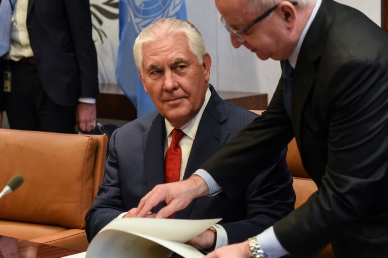 U.S. Secretary of State Rex Tillerson signs a book in the office of the Secretary-General of the United Nations Antonio Guterres at the United Nations headquarters in New York City