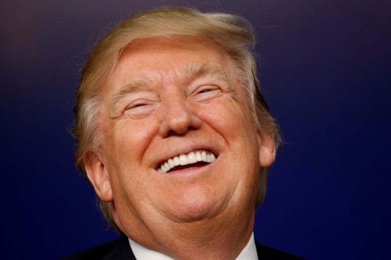 Trump laughing Reuters