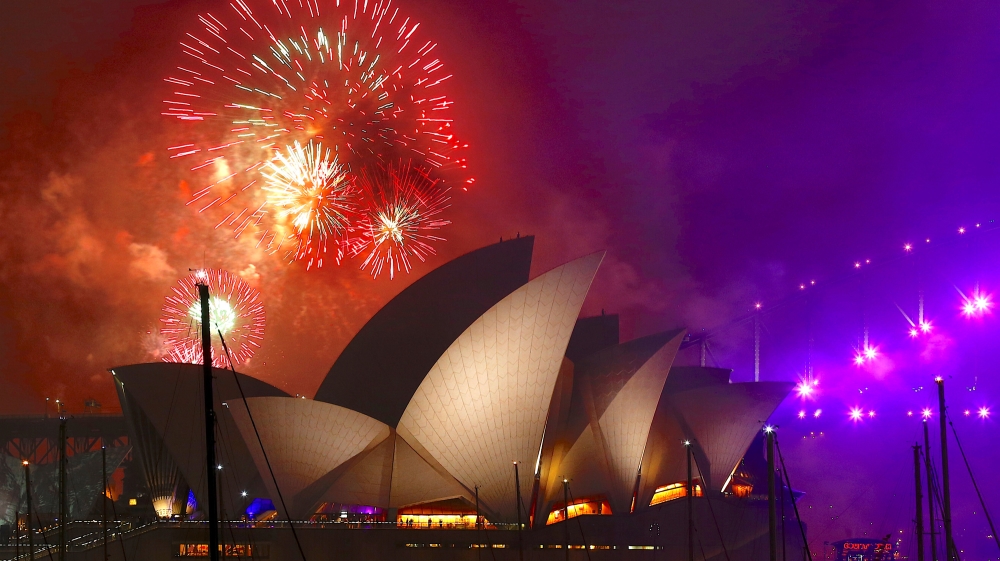 Fireworks explode near the Sydney Opera House as part of new year celebrations on Sydney Harbour, Australia. [David Gray/Reuters]