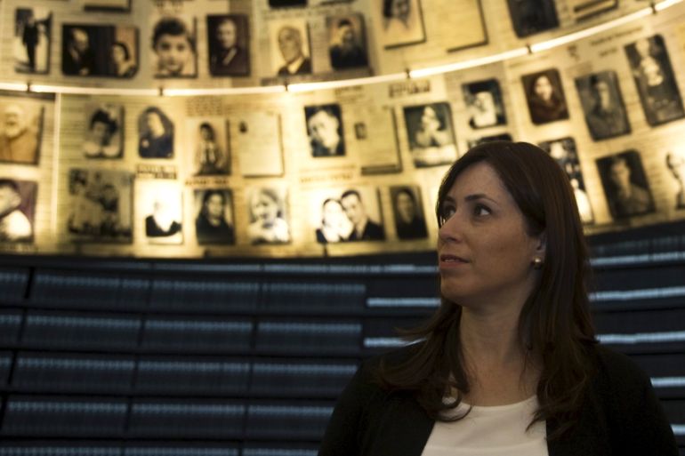 Italian Foreign Minister Gentiloni and Israel''s Deputy Foreign Minister Hotovely look at pictures during a visit to Yad Vashem in Jerusalem
