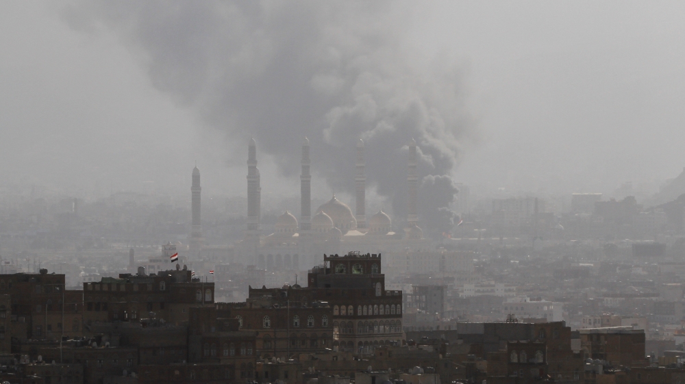 Smoke is seen over Sanaa where clashes continued for a fourth day on Saturday [Mohamed al-Sayaghi/Reuters]