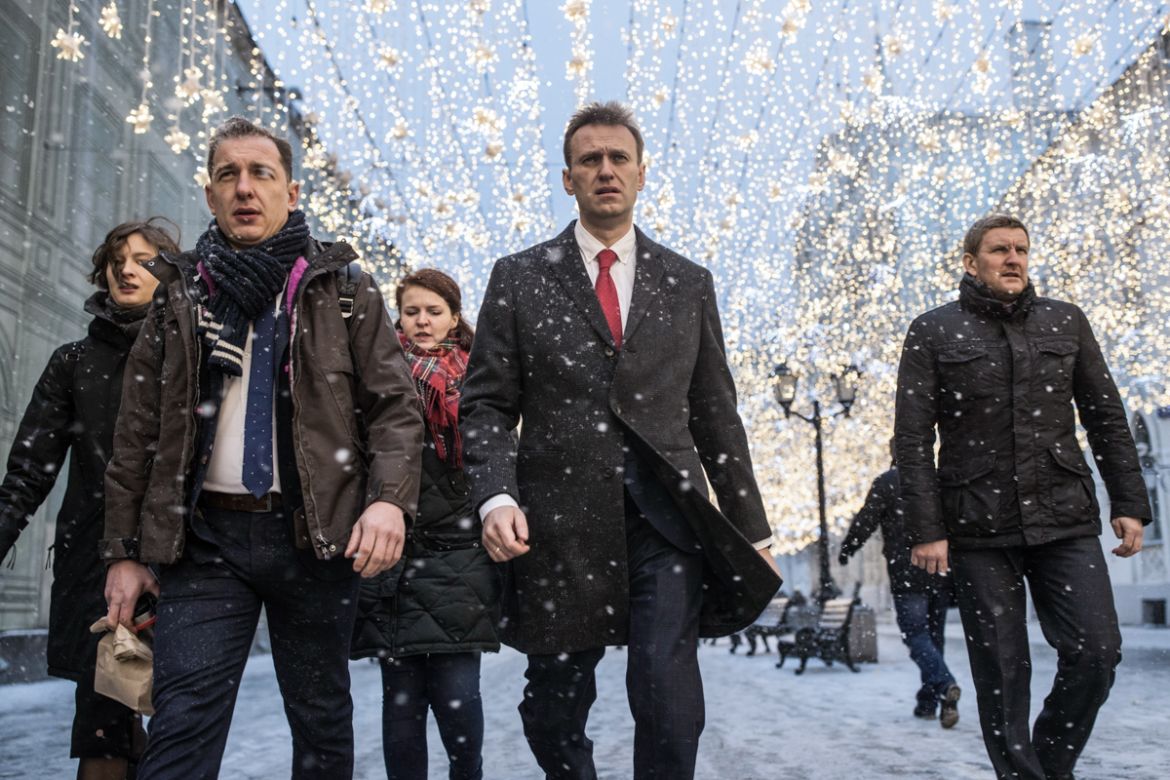 Russian opposition leader Alexei Navalny, who submitted endorsement papers necessary for his registration as a presidential candidate, center, heads to attend a meeting in the Russia''s Central Electio